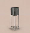 Large black pot on stand