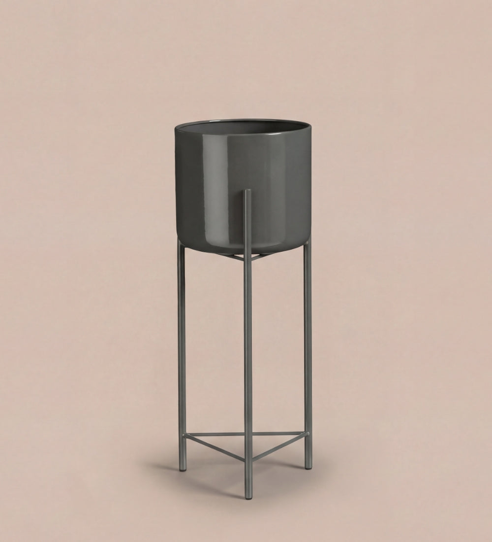Large black pot on stand