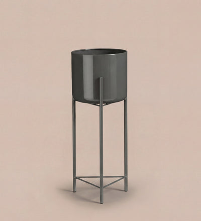 Large black pot on stand