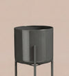 Large black pot on stand