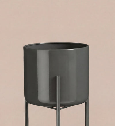 Large black pot on stand