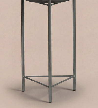 Large black pot on stand