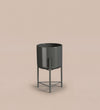 Small black pot on stand
